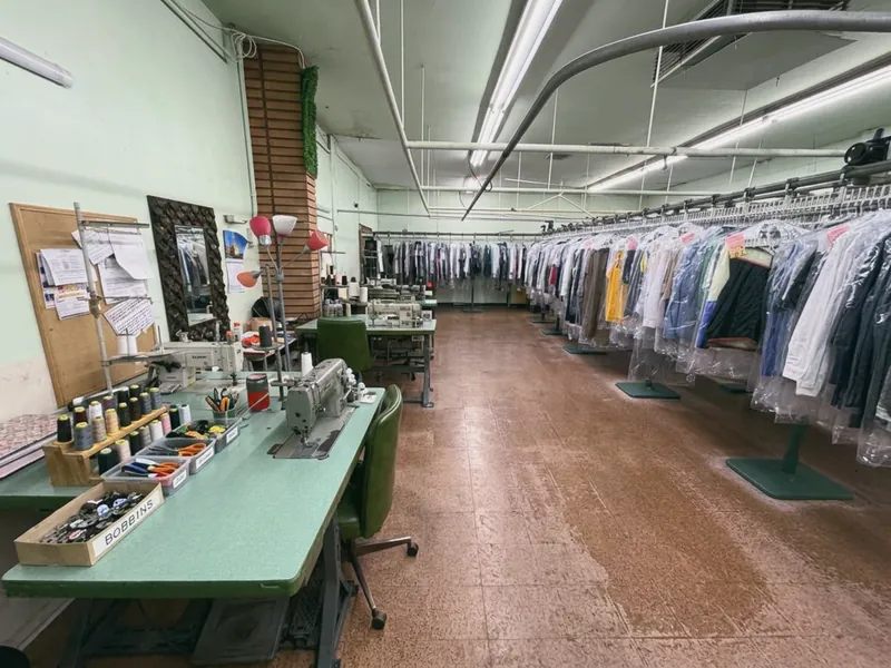 The in-house alterations station with sewing machines and thread